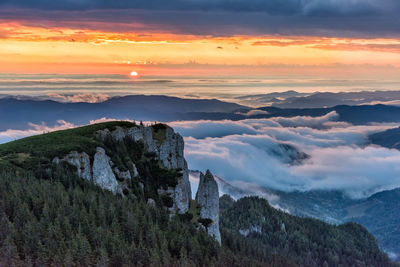 Scenic view of mountains against sky during sunset