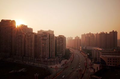 High angle view of buildings against sky during sunset