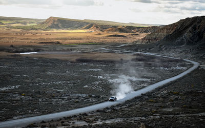 Scenic view of car on road amidst landscape