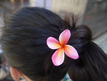 Close-up of flower in woman