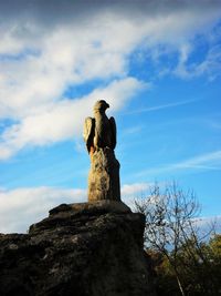 Low angle view of statue against sky