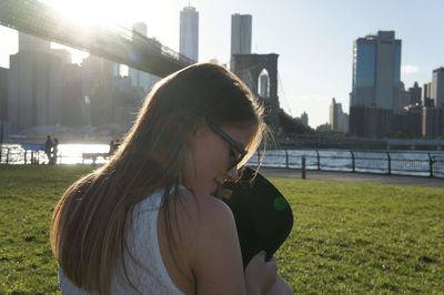 Portrait of young woman in city