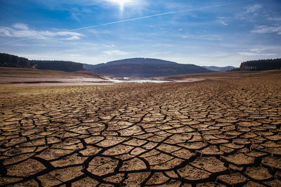 Scenic view of arid landscape against sky