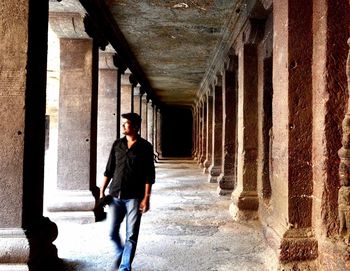 People walking in corridor of building