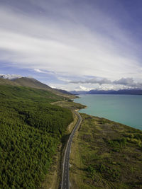 Scenic view of road by land against sky