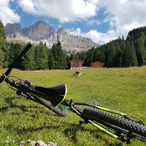 Scenic view of field against sky mountain bike