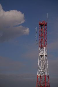 Low angle view of communications tower against sky