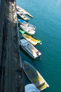 High angle view of sailboats moored in sea