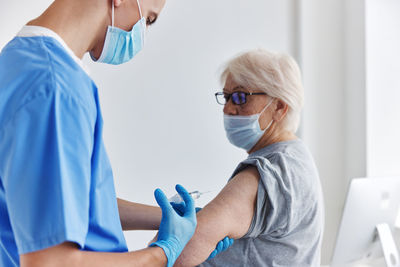 Doctor examining patient at clinic