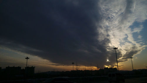 Cars on road at sunset