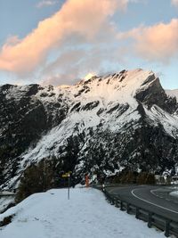 Scenic view of snow covered mountains against sky