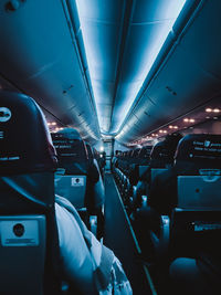 Midsection of man sitting in airplane