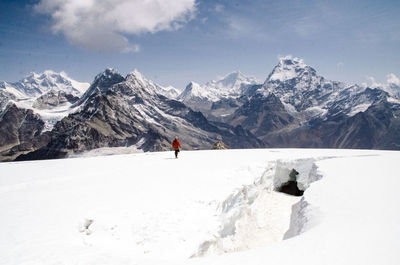 Scenic view of snow covered mountains