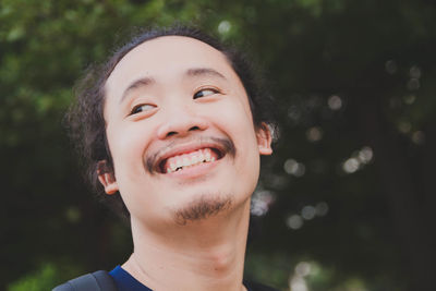 Close-up portrait of a smiling young man