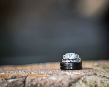 Close-up of wedding rings on rock