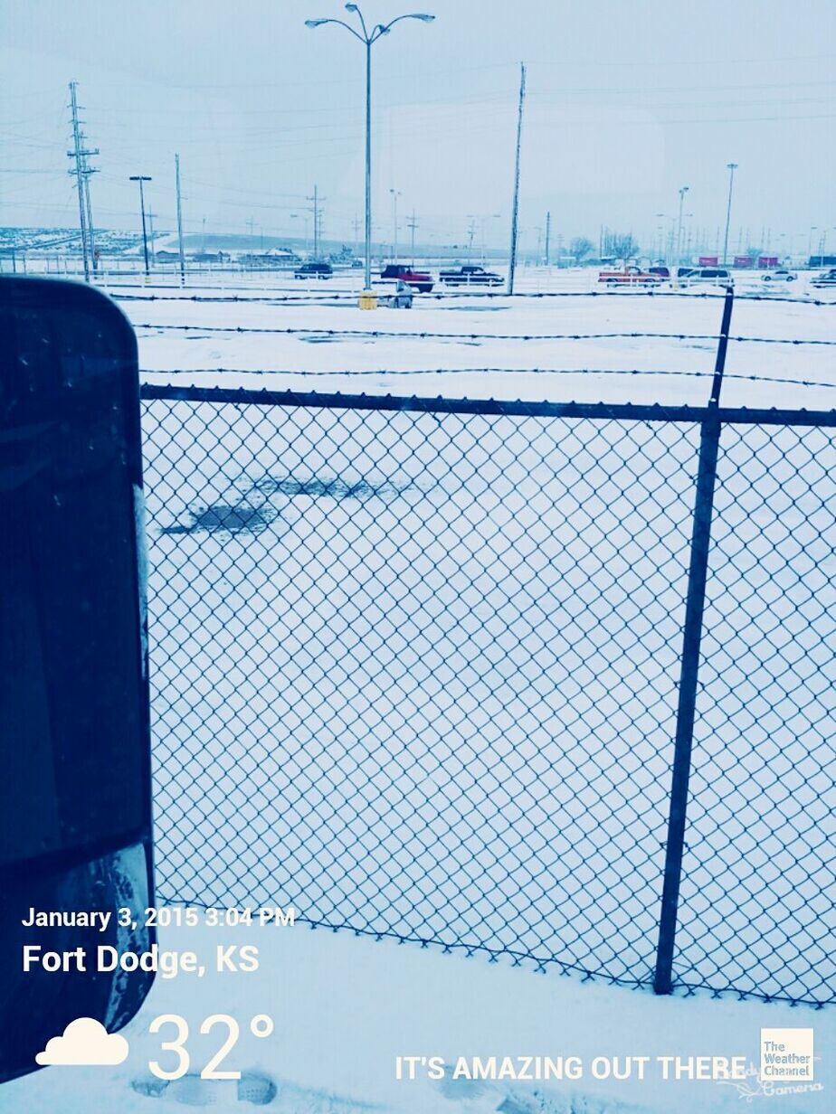 transportation, mode of transport, text, communication, western script, sky, car, land vehicle, day, outdoors, travel, no people, number, white color, safety, snow, cold temperature, fence, protection, metal