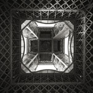 View of the underside of the eiffel tower in b/w