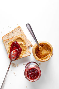 High angle view of breakfast on table against white background