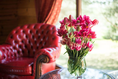 Close-up of pink flower vase on table