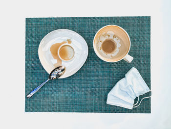 High angle view of coffee cups on table