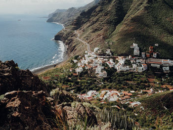 High angle view of sea by buildings