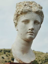 Close-up of bust against clear sky