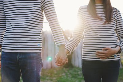 Rear view of couple standing outdoors