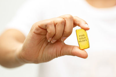 Close-up of hand holding text