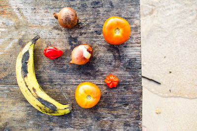 Directly above shot of fruits and vegetables on table