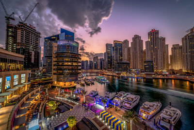 High angle view of illuminated buildings in city at night