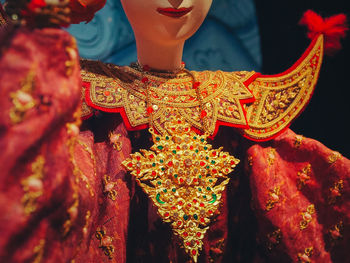 Midsection of woman dancing in traditional clothing