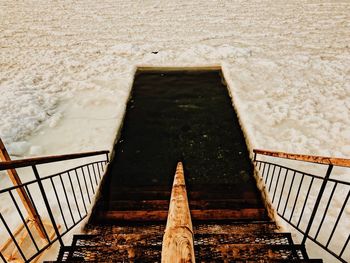 High angle view of footbridge over sea