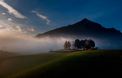 Scenic view of field against sky during sunset