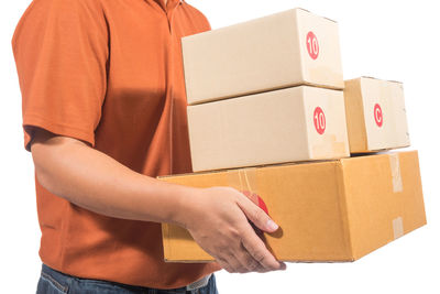 Close-up of man holding stack