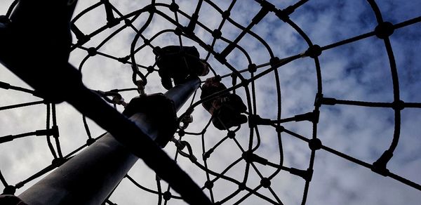 Low angle view of silhouette fence against clear sky