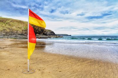 Scenic view of beach against sky