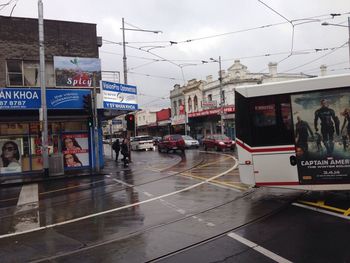 Road in city against sky
