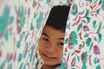 Close-up of boy seen through fabric