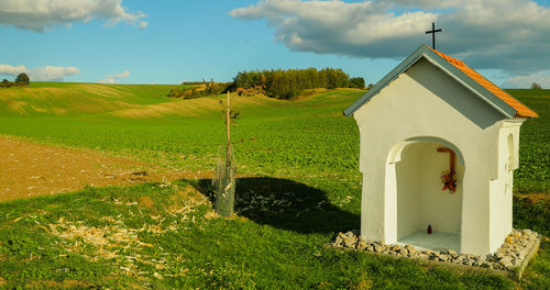 House on field against sky