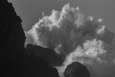 Low angle view of silhouette mountain against sky