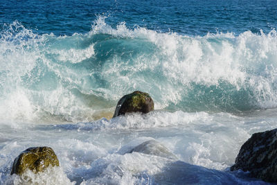 Waves splashing on rocks