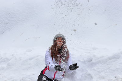 Person standing on snow covered field