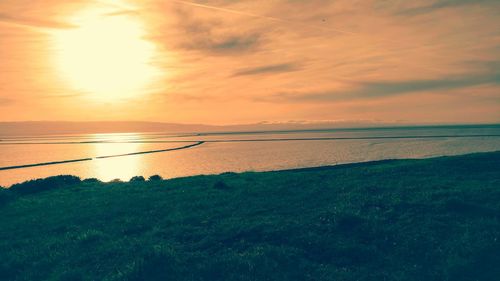 Scenic view of sea at sunset