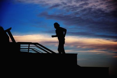 Silhouette of man at sunset