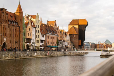 Ancient crane - zuraw old town in gdansk. the riverside on granary island reflection in moltawa