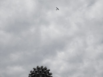 Low angle view of airplane flying in sky