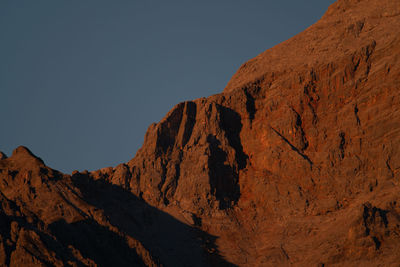 Scenic view of rocky mountains against clear sky