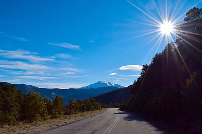 Empty road passing through landscape