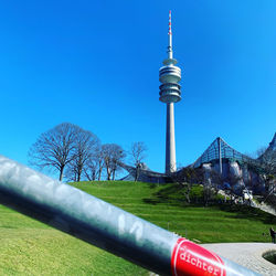 View of communications tower against blue sky