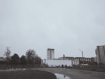 View of road along buildings